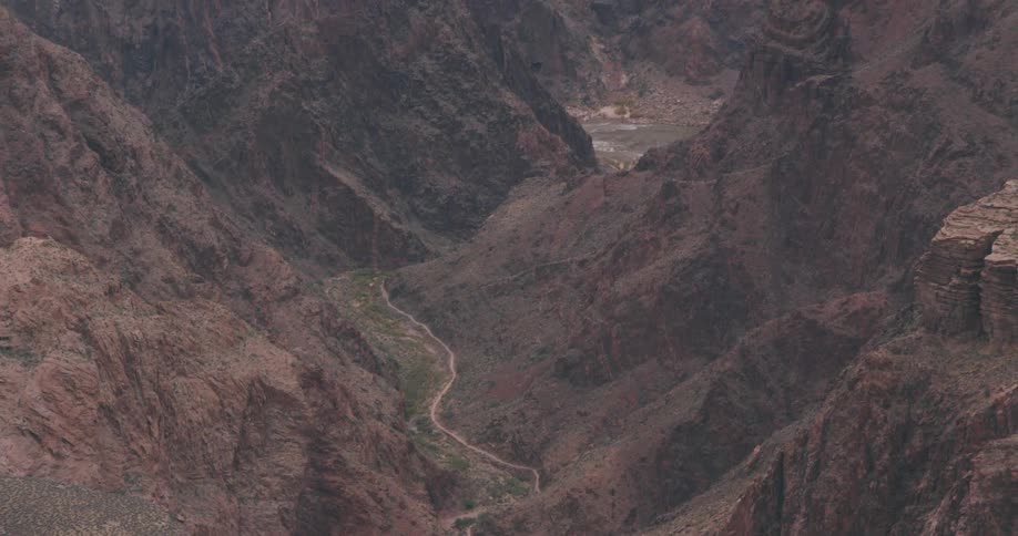 Aerial view of mountains and a deep valley with steep sides of rocks