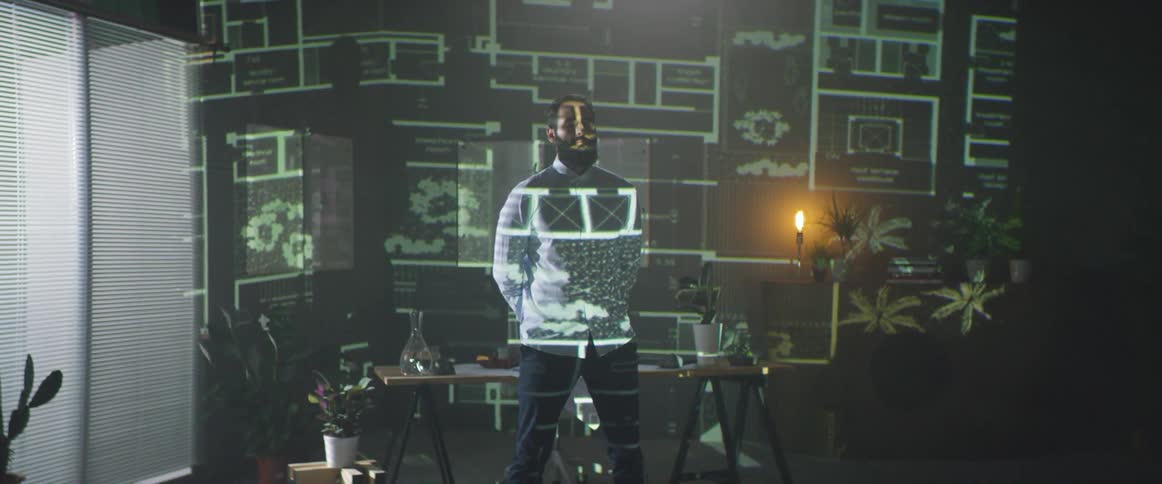Images are projected onto a man and wall
