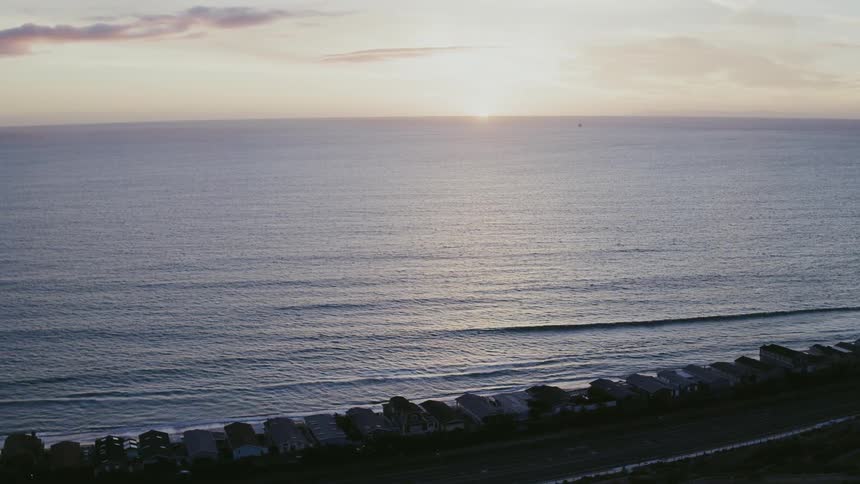 The sun sets over the ocean