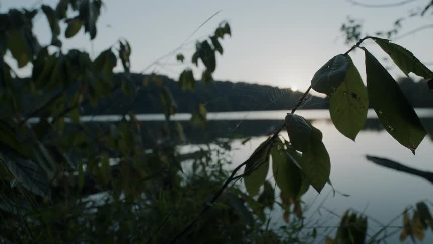 The lake is calm as the sun sets