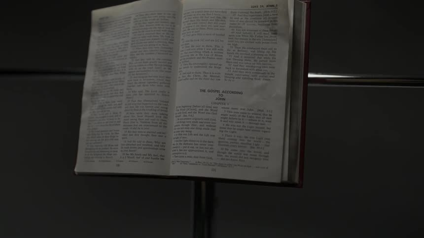 The Bible on a metal pole