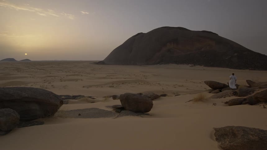 The sun sets over the desert