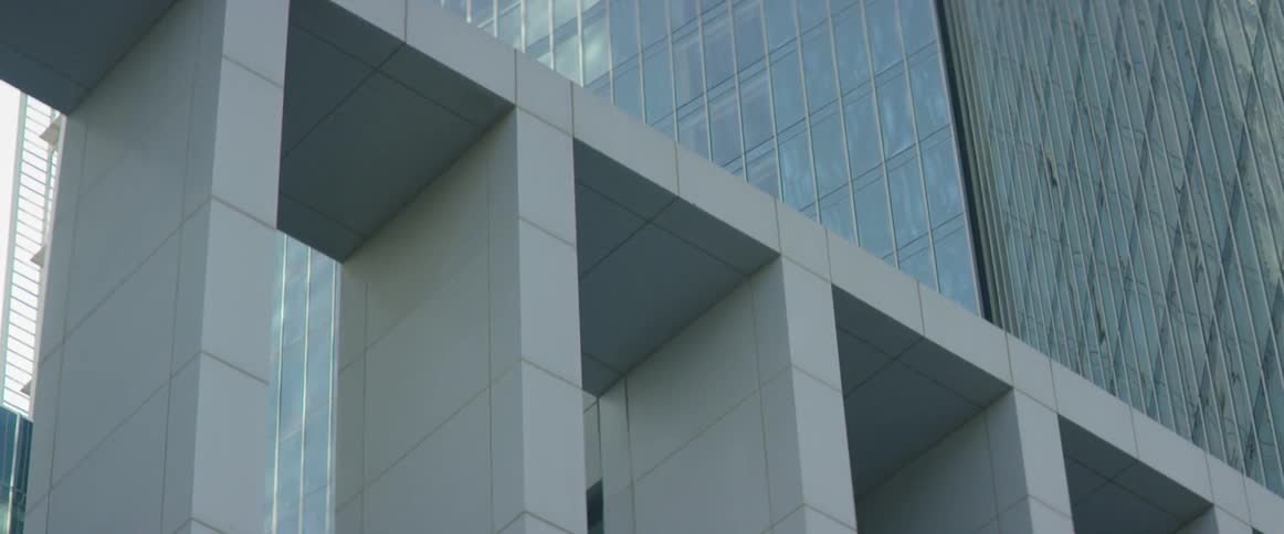 A white archway at the base of a building