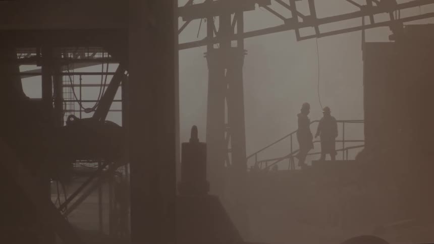 People are walking around a steel factory
