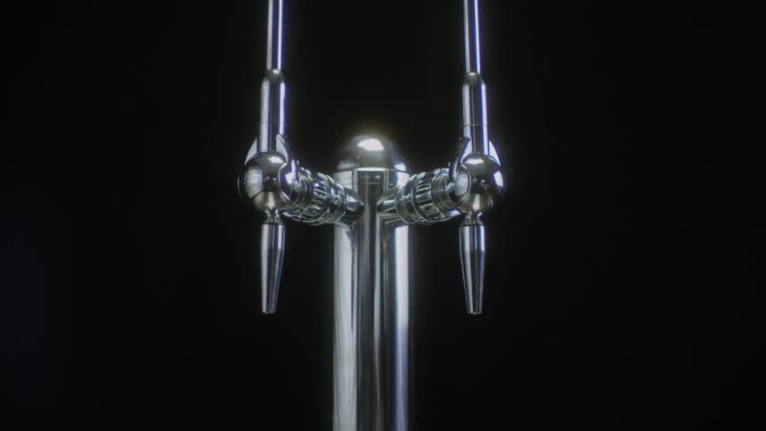 Light reflects on a chrome tap