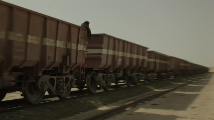 A train travels through a desert
