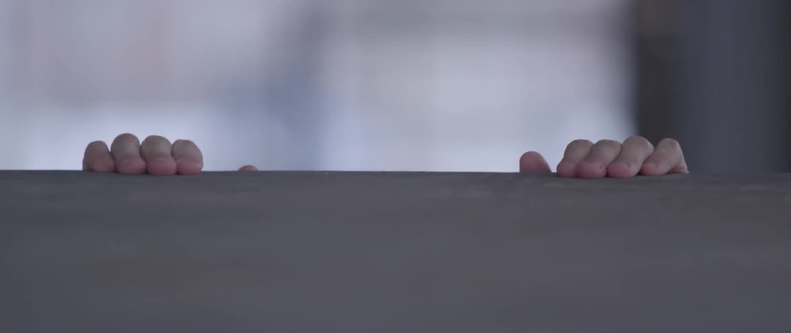 A man runs to a high step and jumps up to get above it
