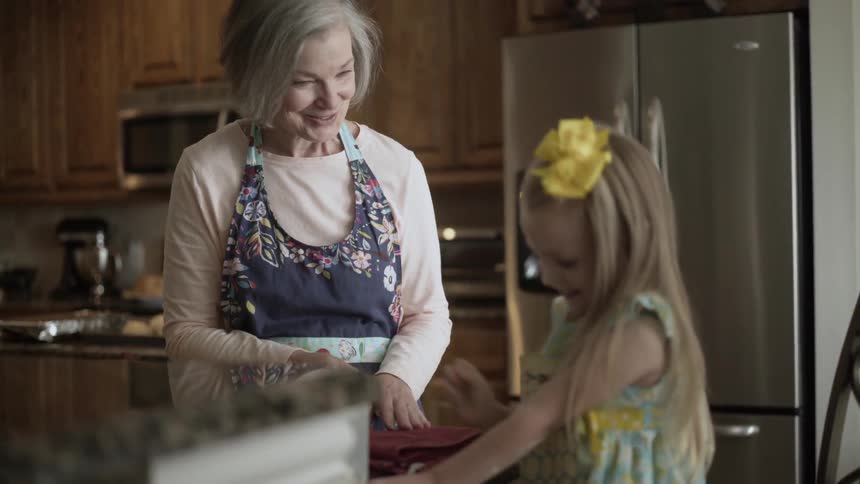Woman and child making cookies