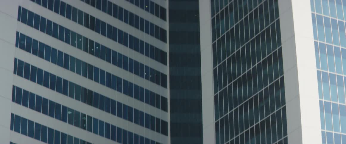The building is tall and full of windows