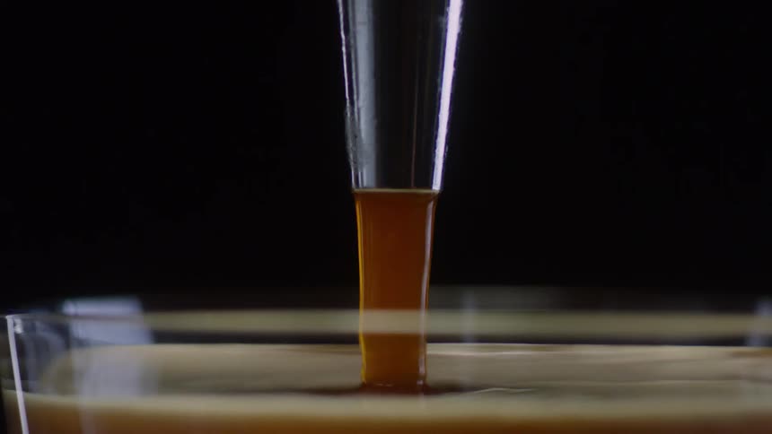 Liquid is poured into a glass