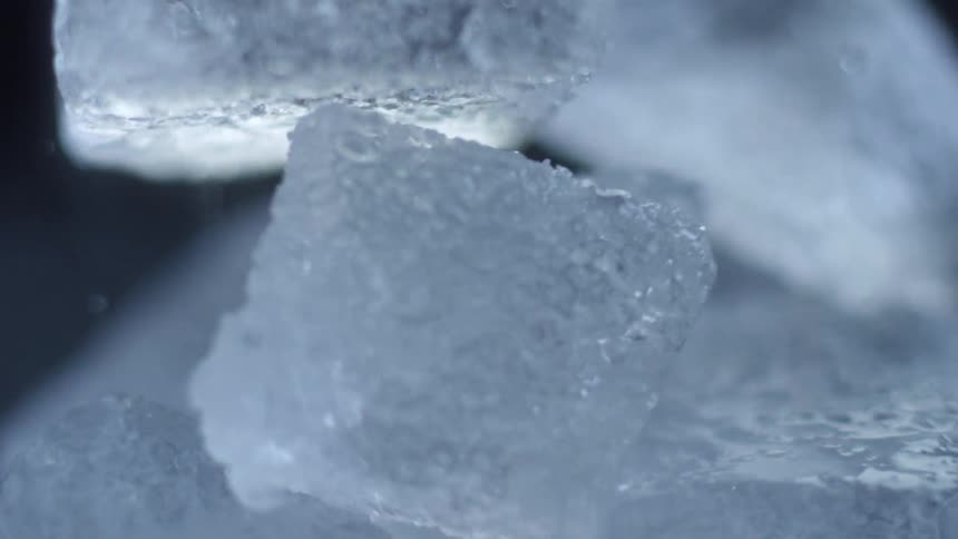 Ice falling into a cup