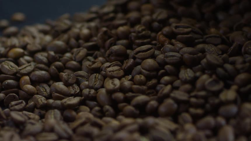 Coffee beans are stacked in a pile