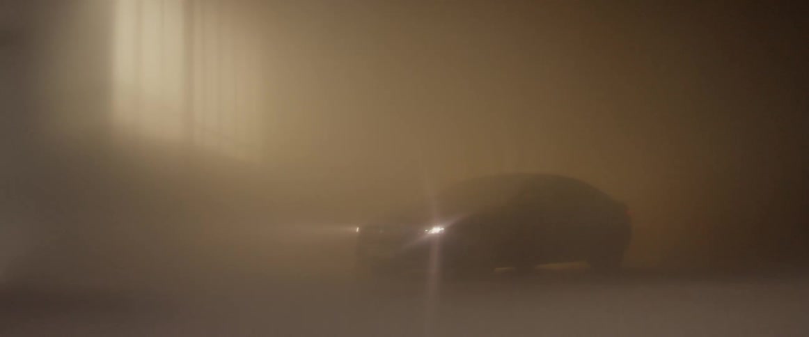 A car turns on its headlights