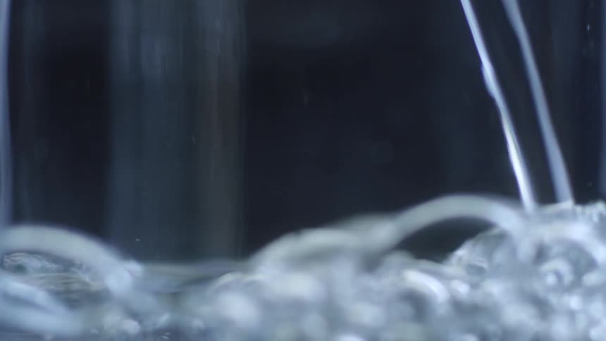 Water is poured into a glass