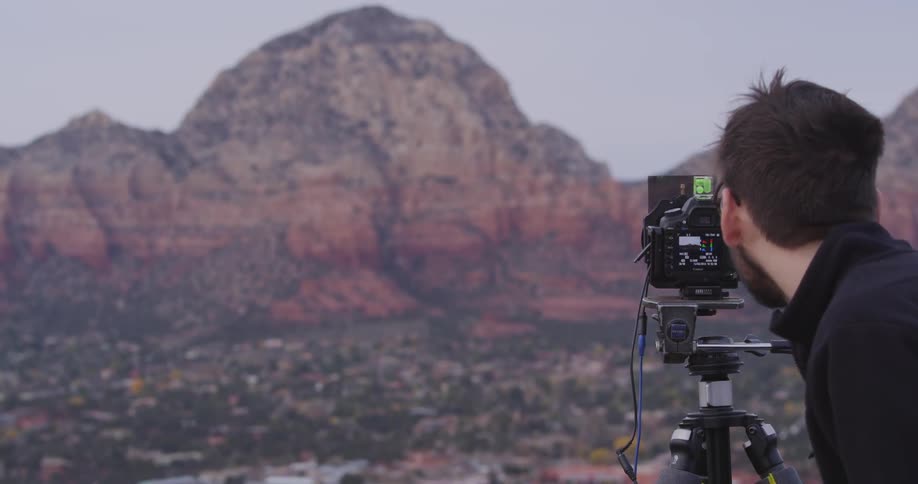 A person taking pictures of nature