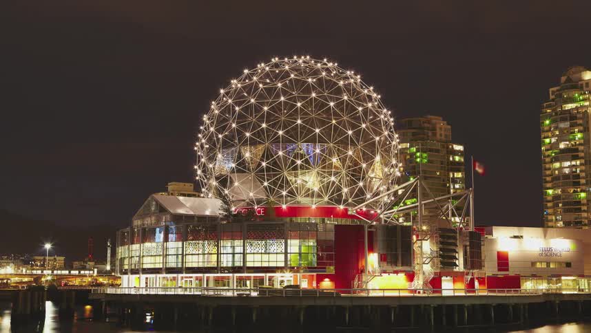 A domed structure sits in the downtown part of a city
