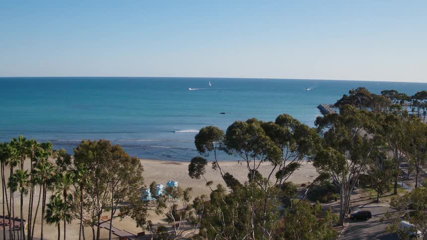 A view of the ocean from up high slowly moving down lower