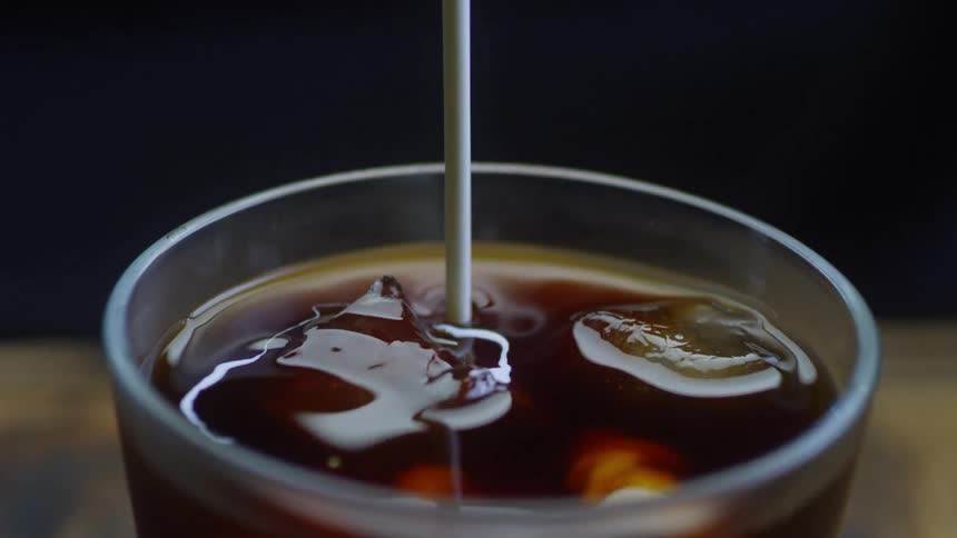 Cream is poured into a glass