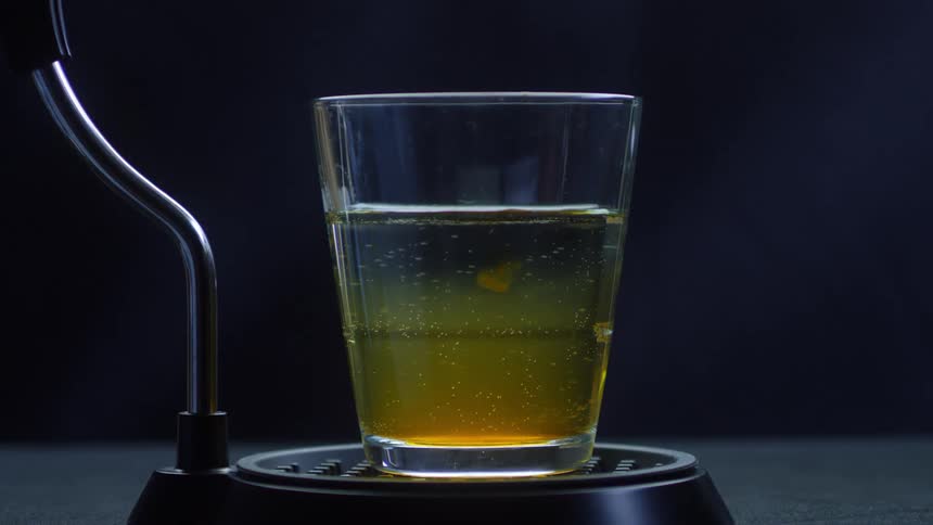 Liquid drips into a glass