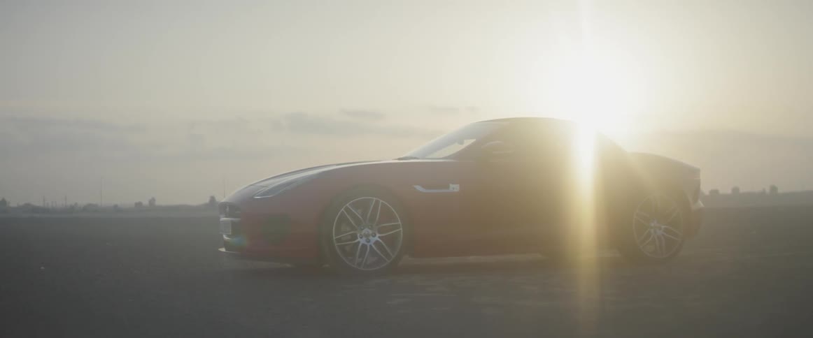 The sports car is parked in the lot