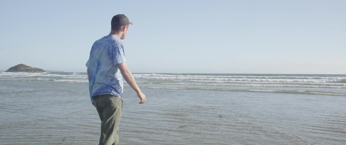 A person walking on the beach