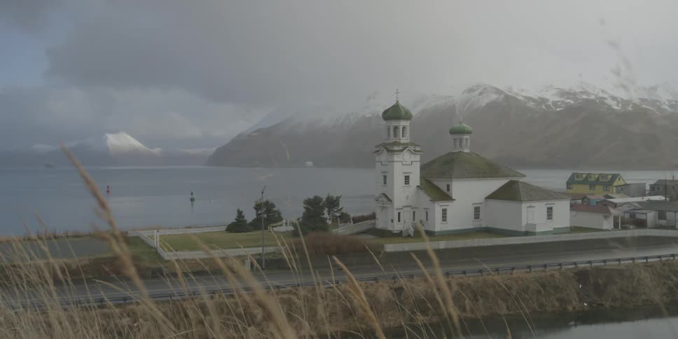 A church sits near the sea