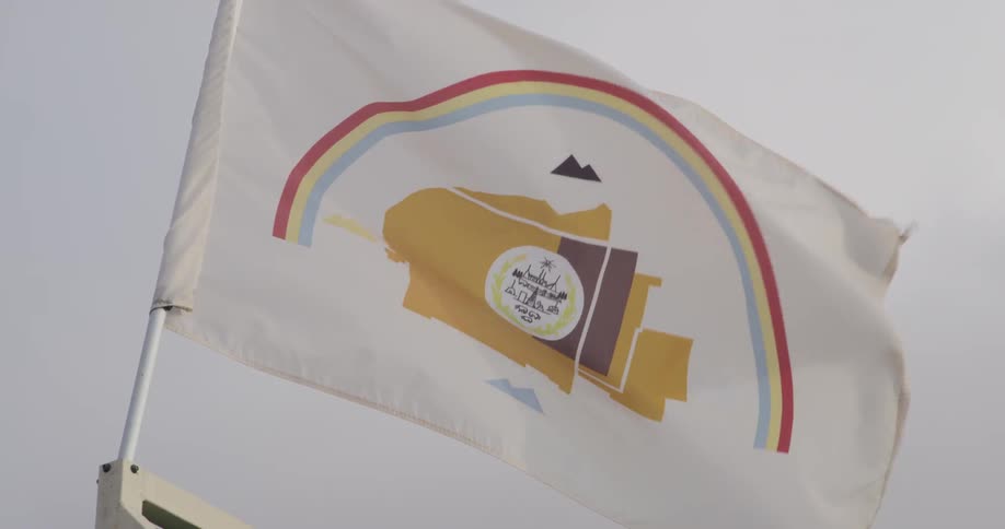 A flag billows in the wind