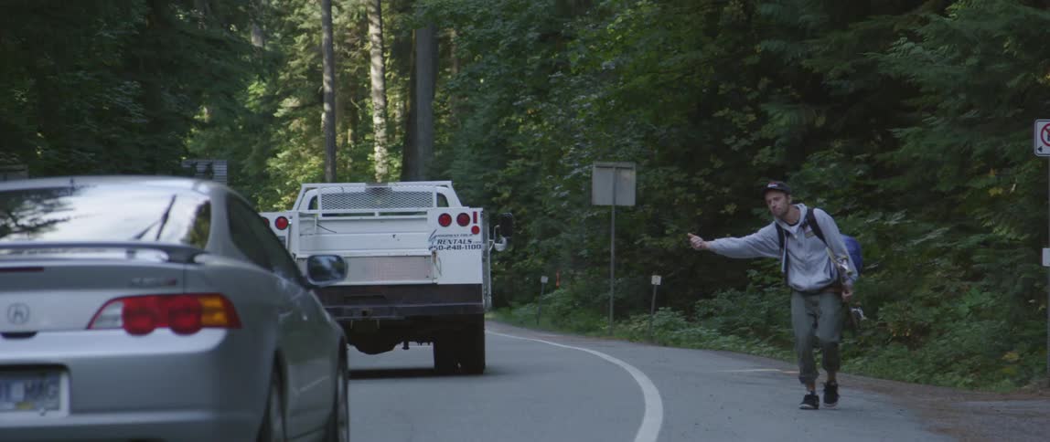 A person trying to hitch  ride