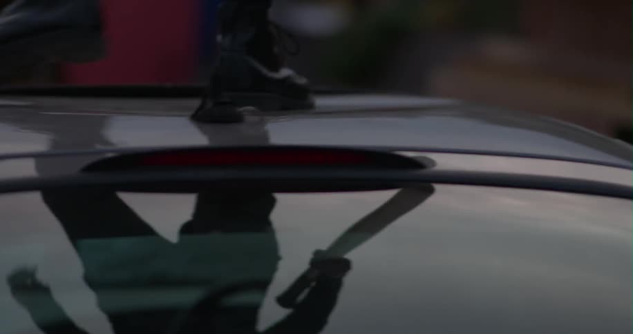 Someone beats a car with a bat