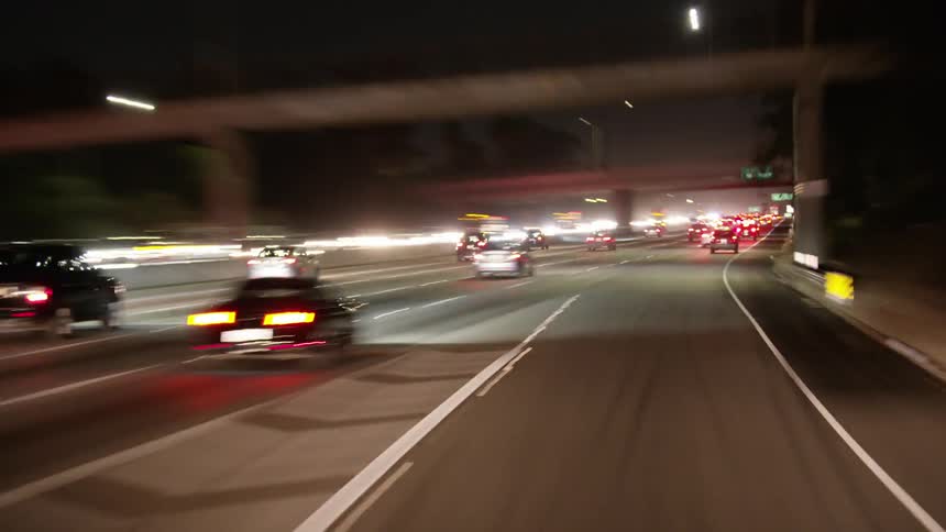 Speeding down a highway at night