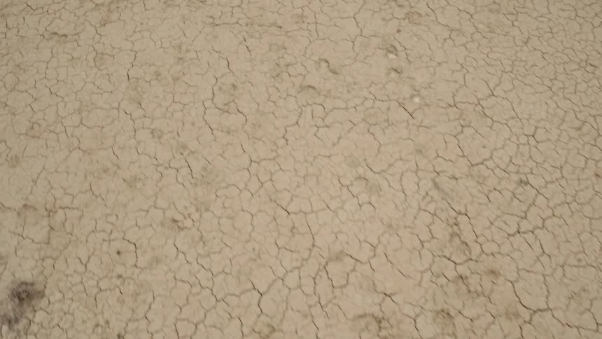 The long desert has many cracks and rocks