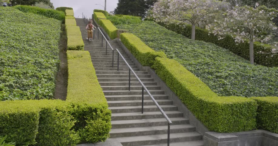 Man skiing down an outside flight of stairs
