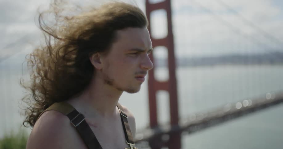 Man takes a deep breath on a windy day
