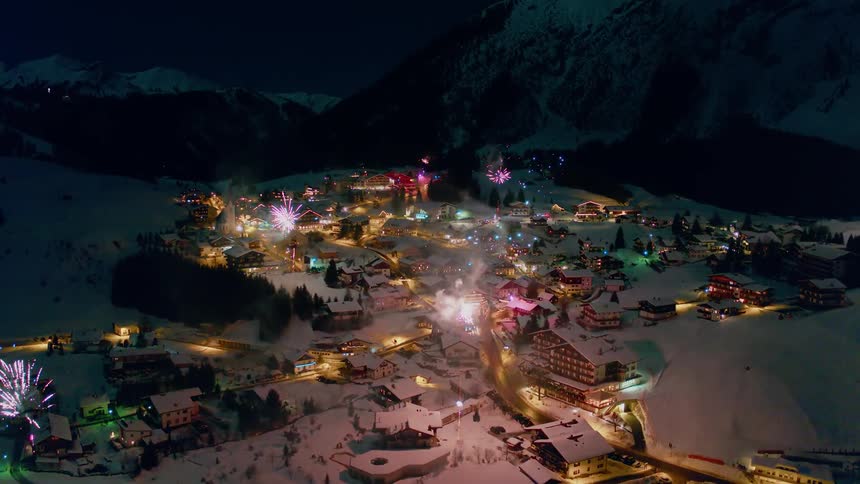 Fireworks above a snowy village