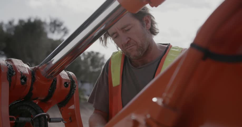 A man calibrates a wrench before working on equipment
