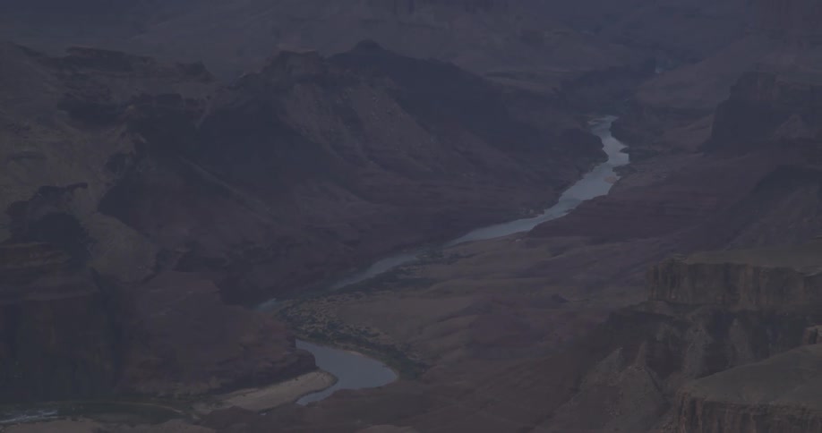 A river winds through a mountain range