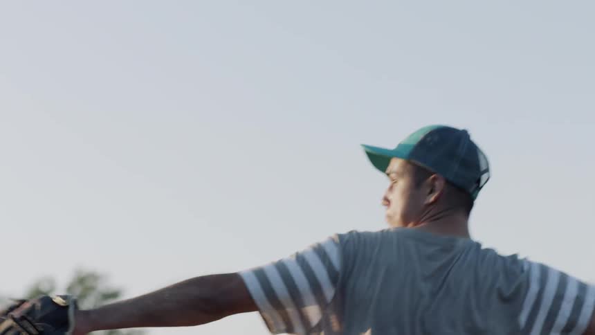 A pitcher throws the baseball