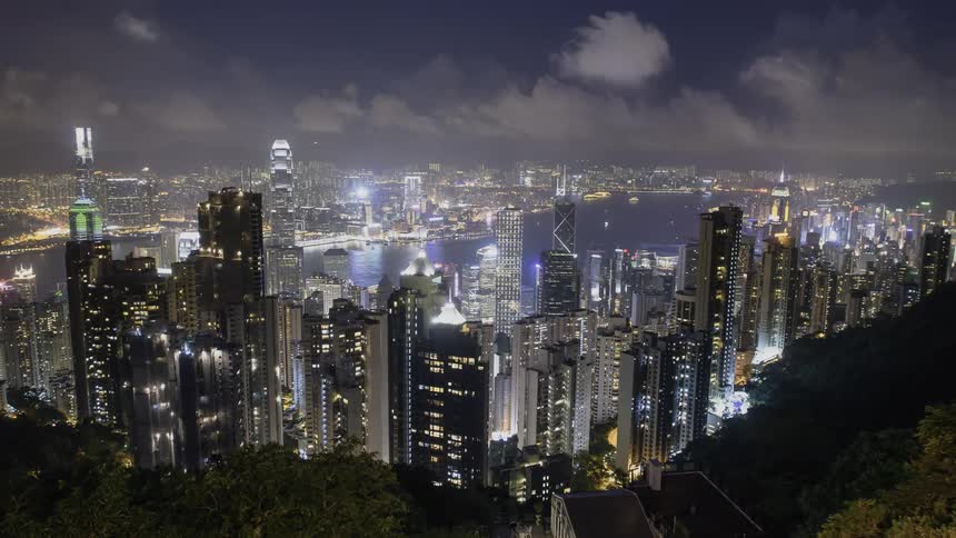 The city below has many bright lit buildings
