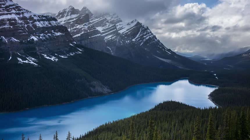 Astonishing blue water of Lake Peyton surrounded by snowy mountains