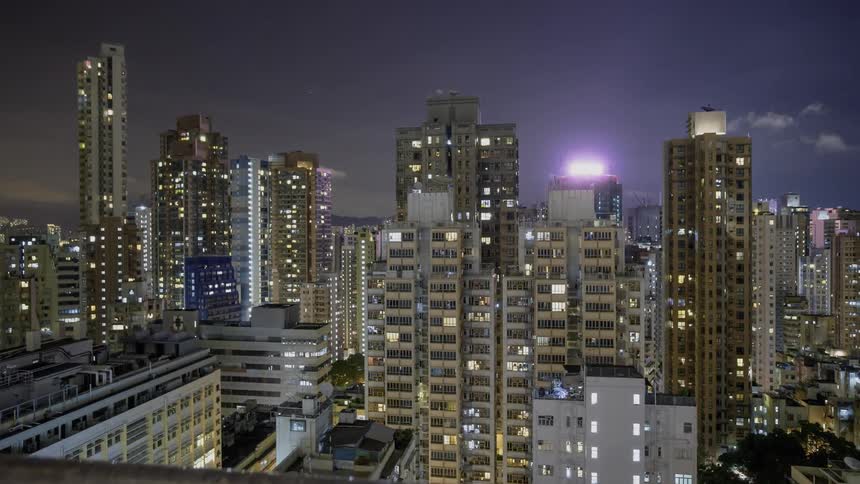 City lights illuminate the night sky
