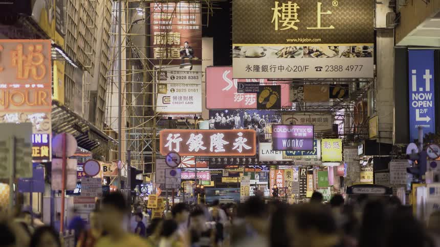 Many people are moving around the city street