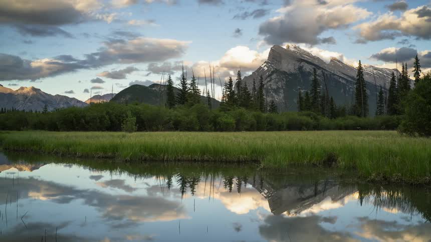 Clouds pass over the beautiful lake and mountains scenery in Banff