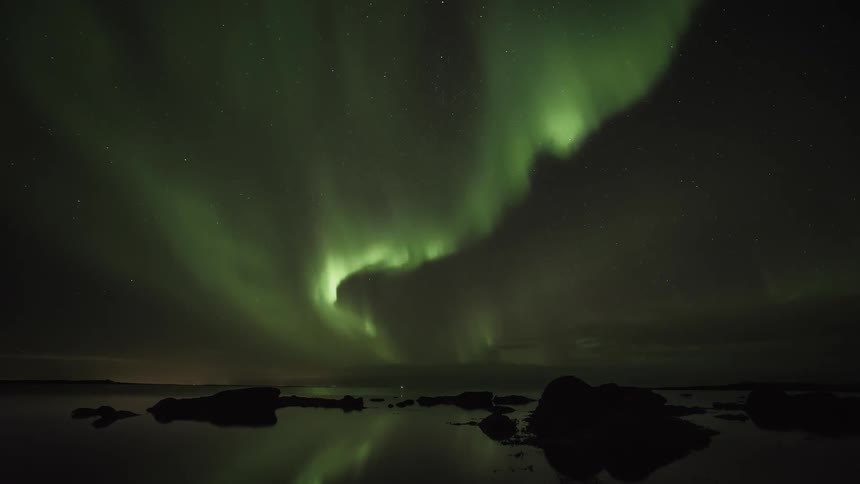 The northern lights flash along the sky