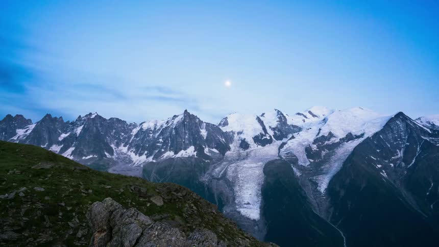 Clouds pass by above the frozen mountain top