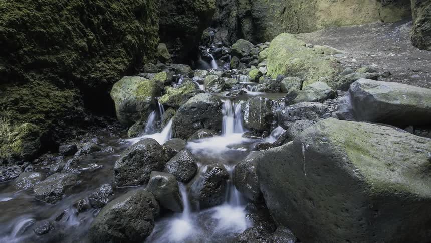 Water flows down a rocky stream