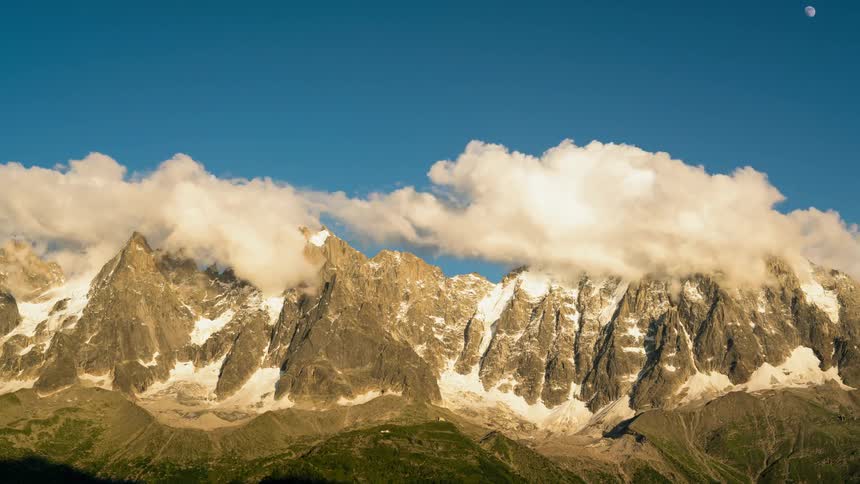 Clouds pass above the frozen mountain