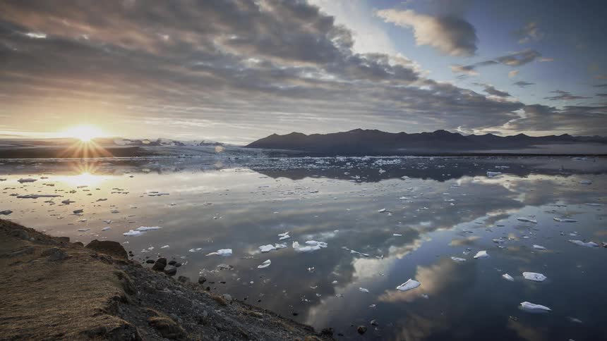 Time lapse of pieces of ice floating around in the sea