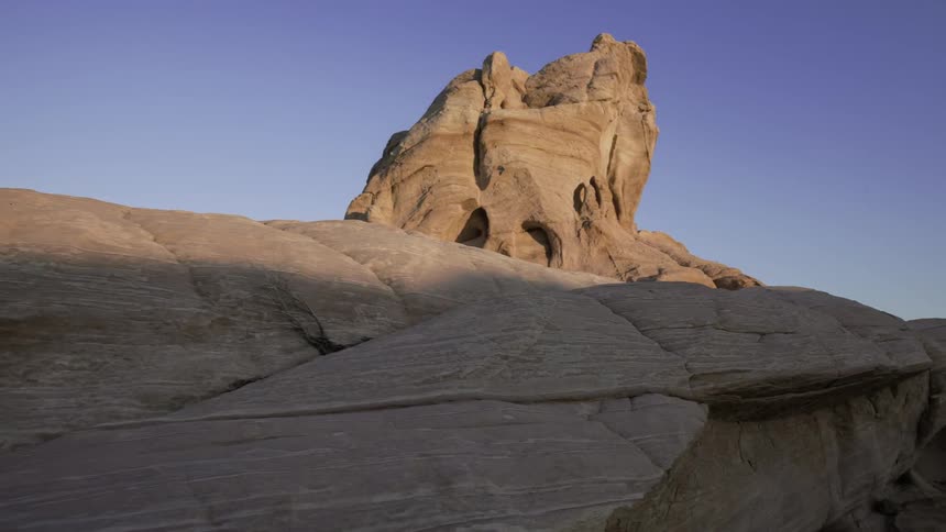 Time lapse of the sun setting on a bunch of rocks