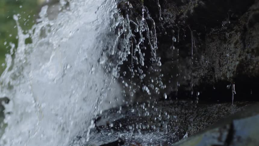 The water splashes off the rocks