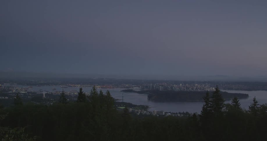 A large city sits near a lake on the coast